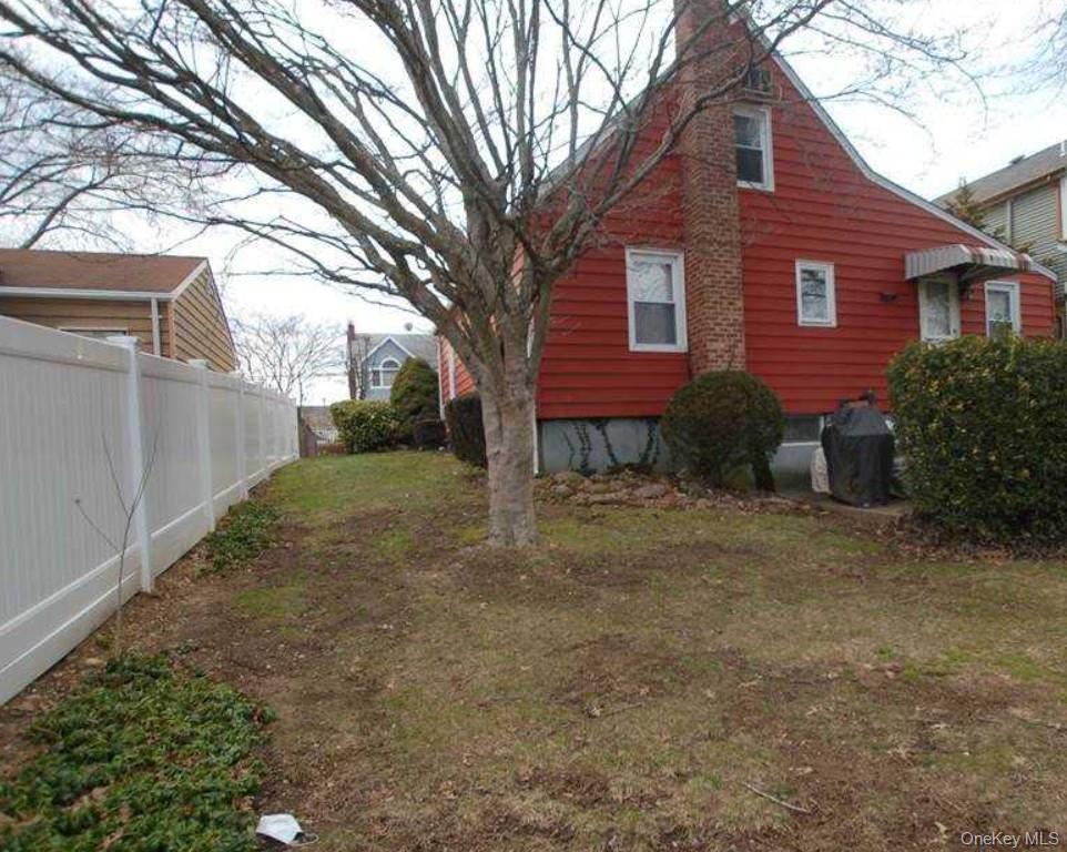 7 Miles Avenue Albertson, NY 11507 - Photo 7 of 8 a view of a house with a yard