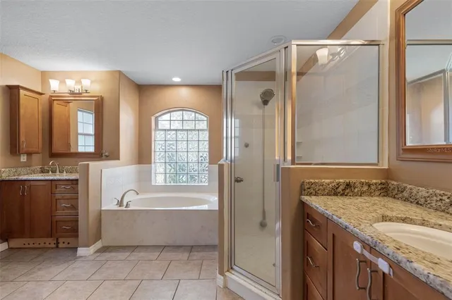 a bathroom with a bathtub and a shower