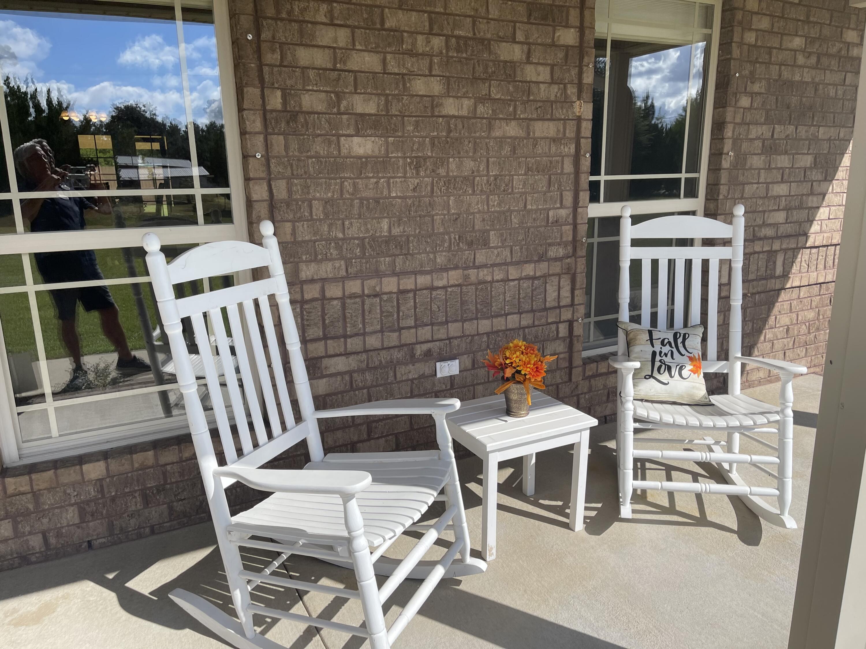 9606 South Trace Road Milton, FL 32583 - Photo 47 of 48 a view of a patio with a table and chairs