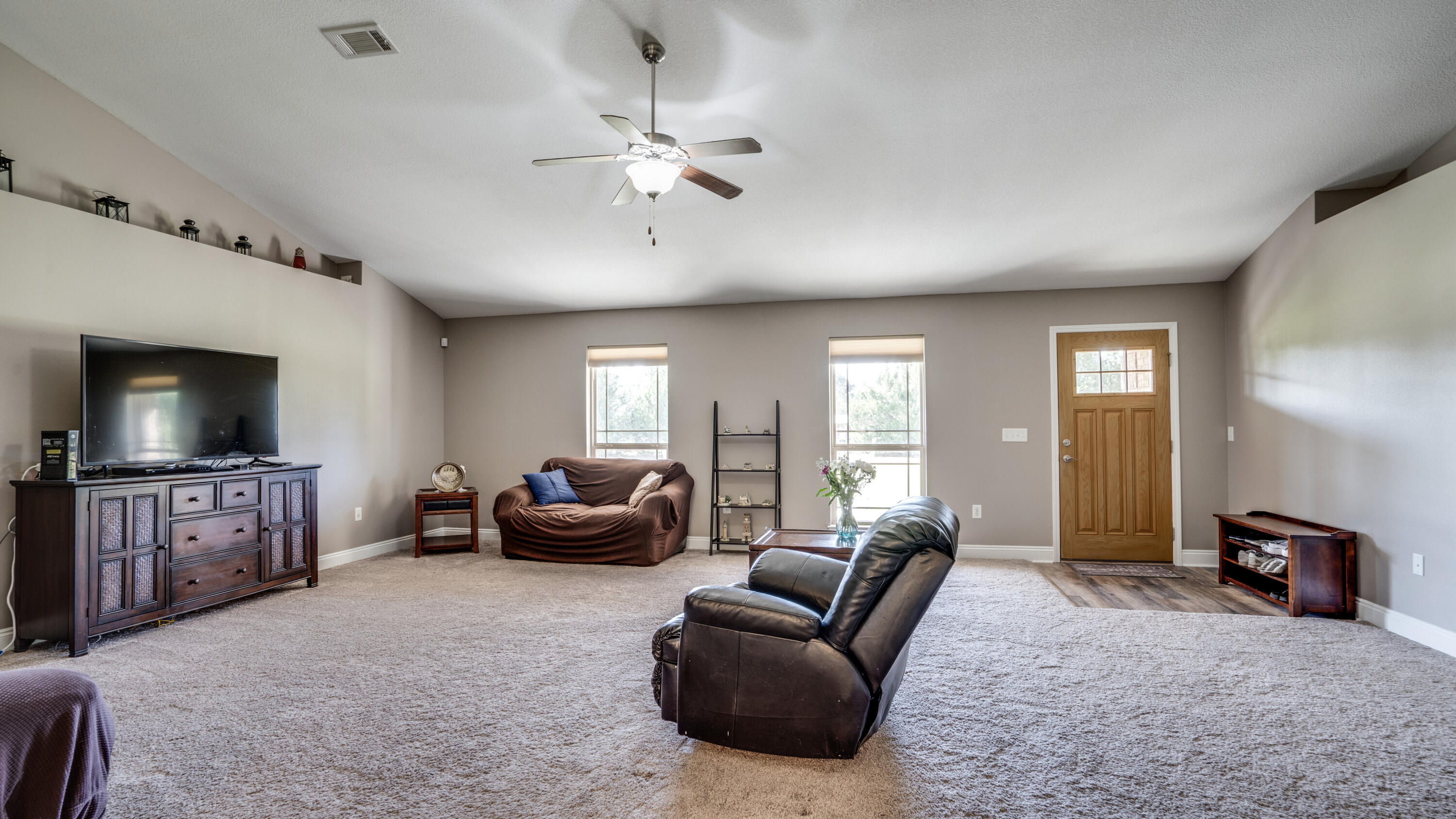 9606 South Trace Road Milton, FL 32583 - Photo 7 of 48 a living room with furniture and a flat screen tv