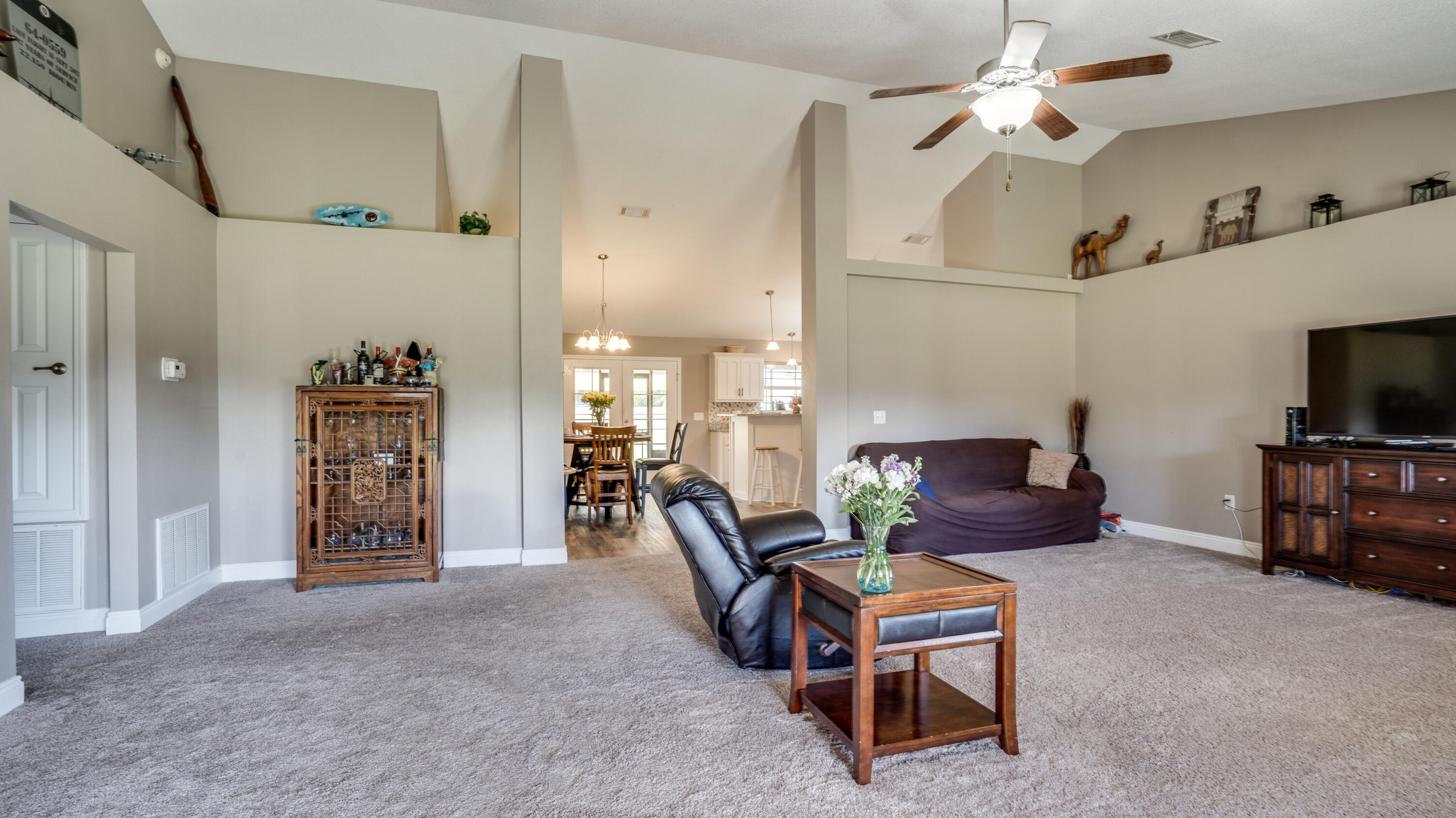9606 South Trace Road Milton, FL 32583 - Photo 8 of 48 a living room with furniture and a flat screen tv