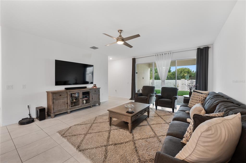 2887 Parkfield Road St. Cloud, FL 34772 - Photo 17 of 51 a living room with furniture and a flat screen tv