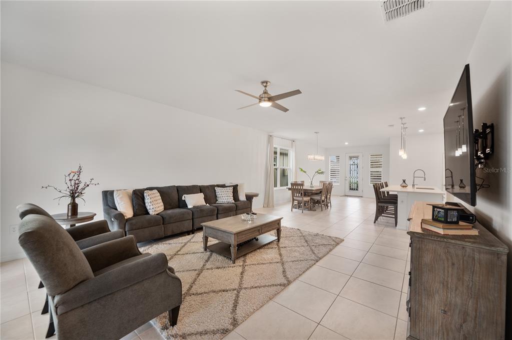 2887 Parkfield Road St. Cloud, FL 34772 - Photo 19 of 51 a living room with furniture and a flat screen tv