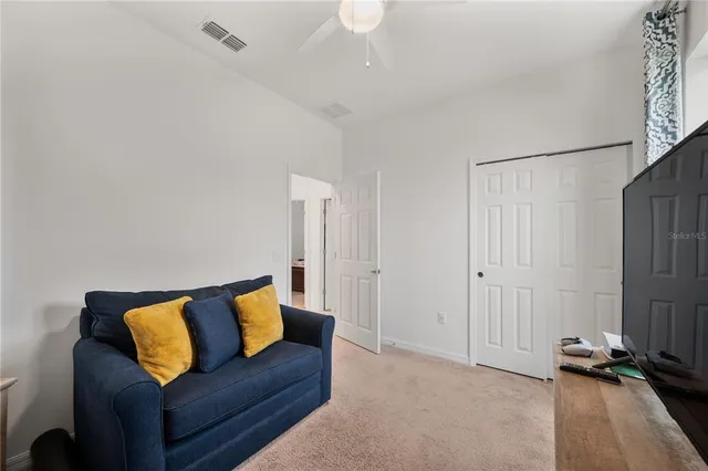 a bedroom with bed and a window