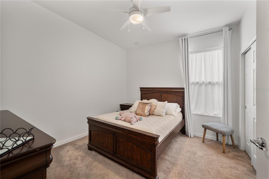 2887 Parkfield Road St. Cloud, FL 34772 - Photo 29 of 51 a bedroom with bed and a window