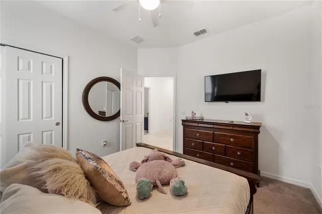 a bathroom with a double vanity sink mirror and toilet