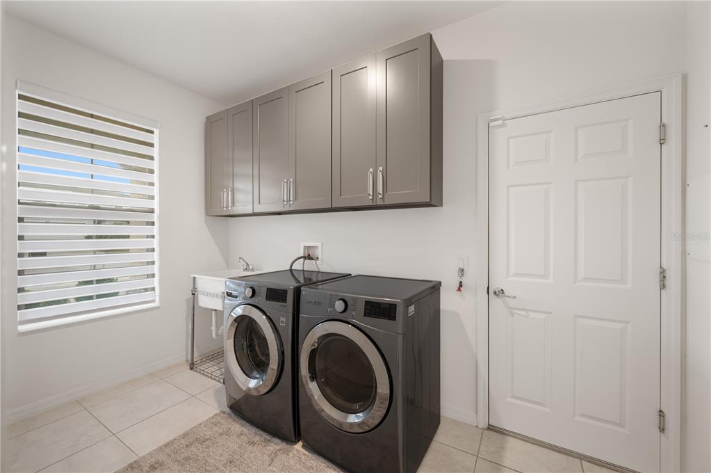 2887 Parkfield Road St. Cloud, FL 34772 - Photo 35 of 51 a utility room with dryer and washer