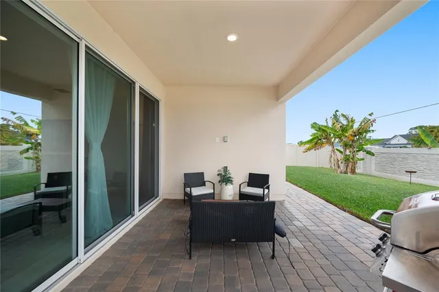 a view of a pathway of a house with a white door