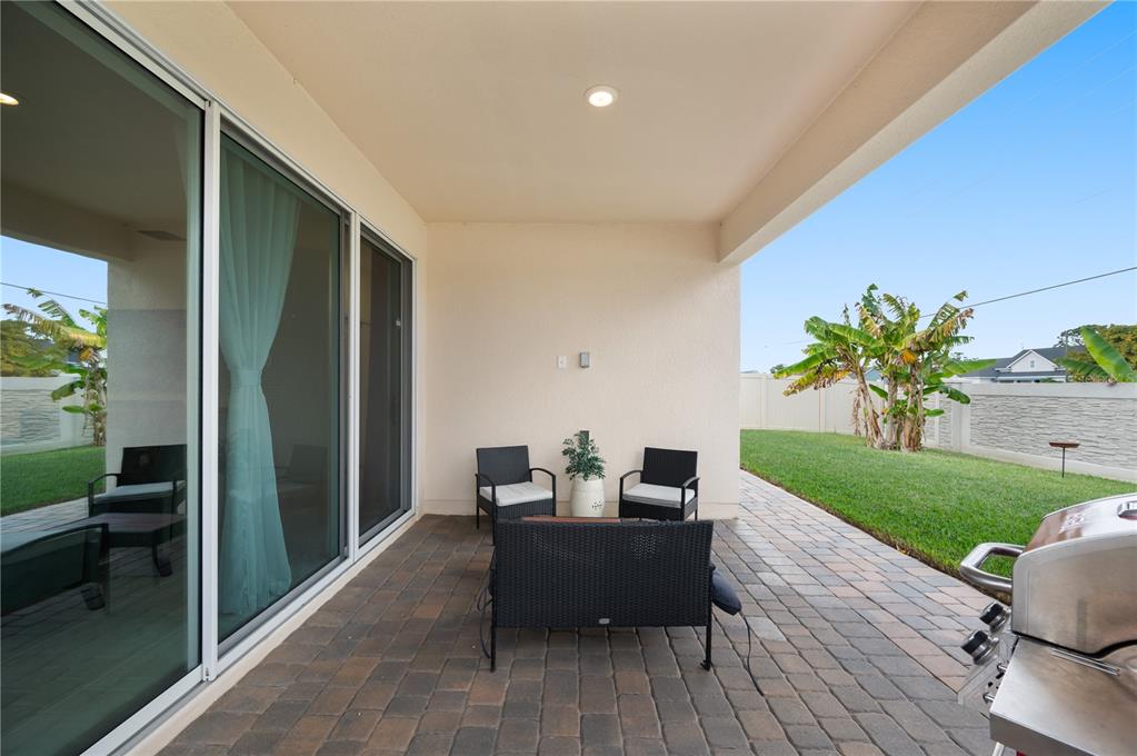 2887 Parkfield Road St. Cloud, FL 34772 - Photo 38 of 51 a living room with furniture floor to ceiling window and wooden floor