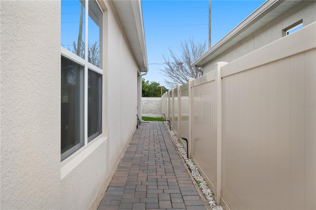 2887 Parkfield Road St. Cloud, FL 34772 - Photo 40 of 51 a view of a pathway of a house with a white door