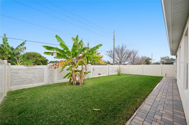 a view of a swimming pool with a yard