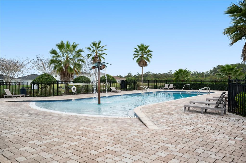 2887 Parkfield Road St. Cloud, FL 34772 - Photo 47 of 51 a view of a swimming pool with a lounge chair