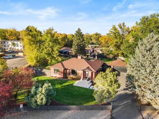 a view of a garden with a building in the background