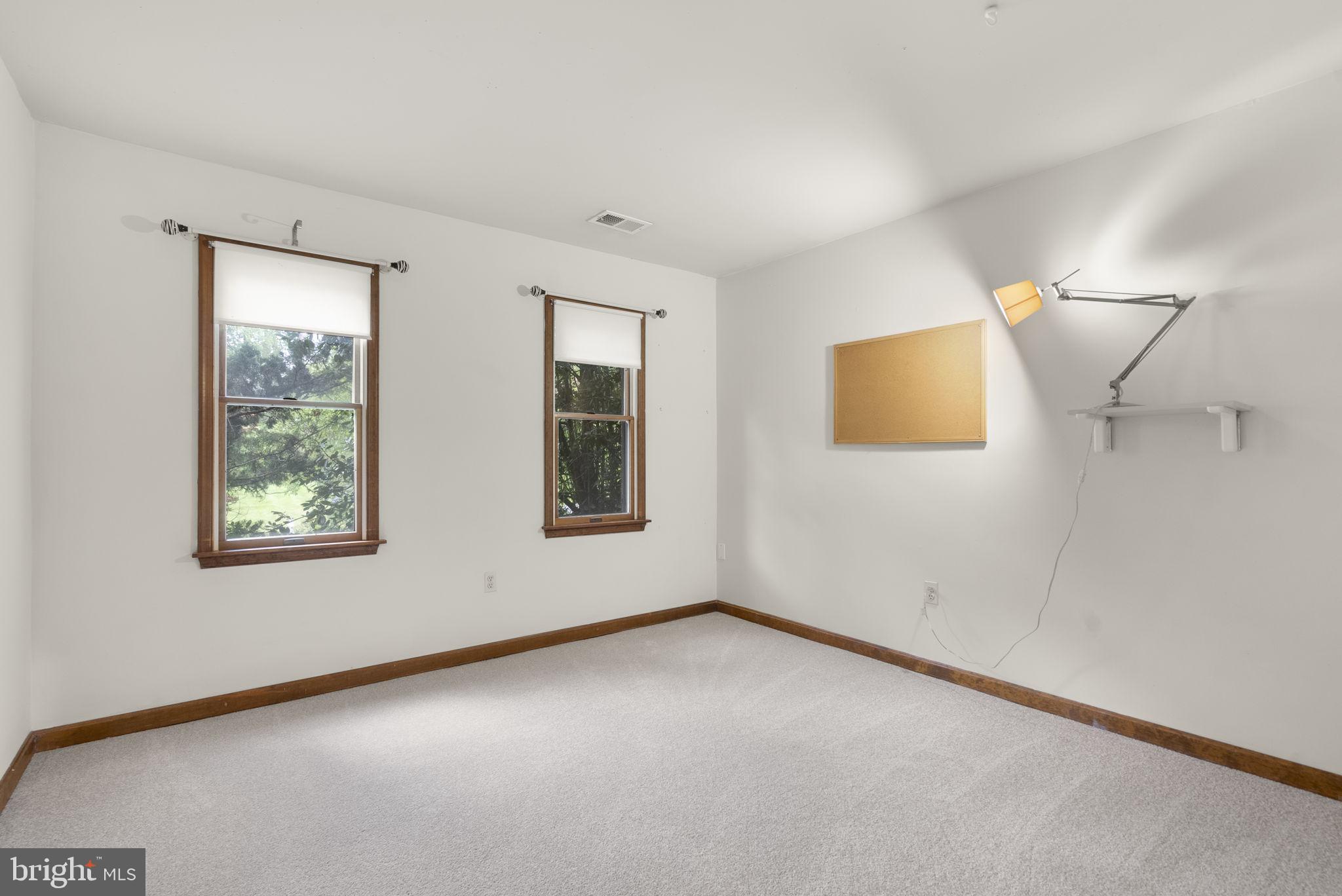 15220 Redgate Drive Silver Spring, MD 20905 - Photo 43 of 65 a view of an empty room with a window