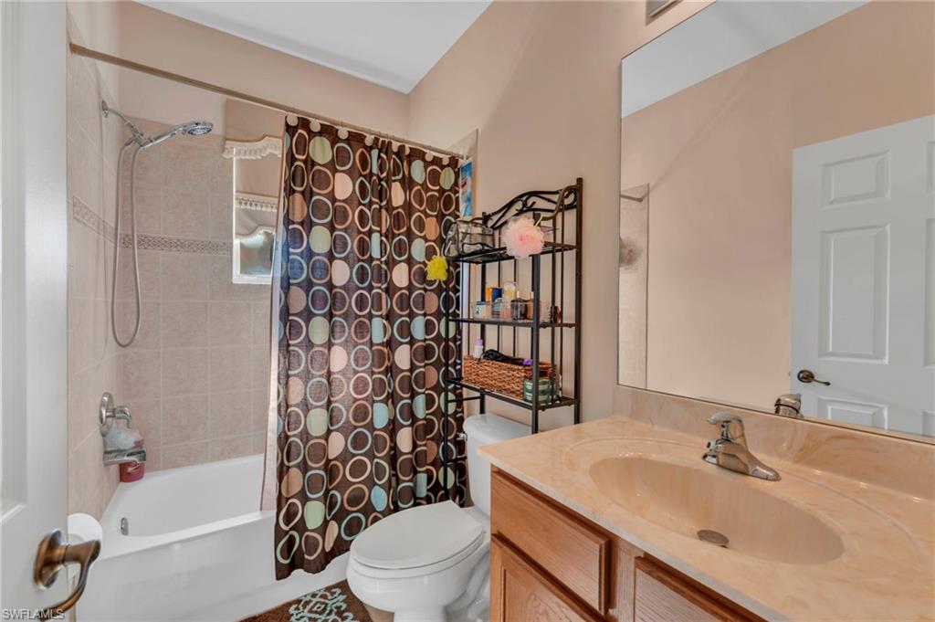 1966 Par Drive Naples, FL 34120 - Photo 12 of 32 Full bath featuring shower / bath combo and vanity