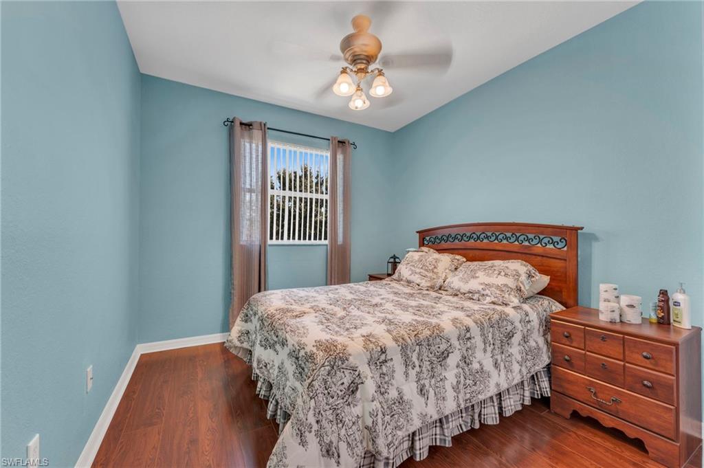 1966 Par Drive Naples, FL 34120 - Photo 16 of 32 Bedroom with dark wood-style floors and ceiling fan