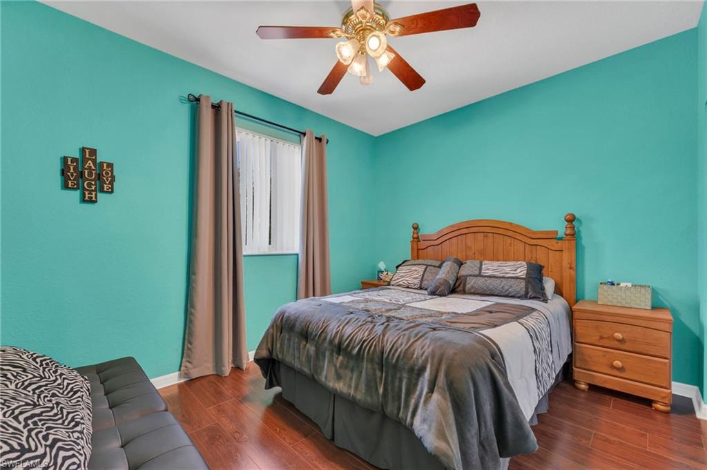 1966 Par Drive Naples, FL 34120 - Photo 17 of 32 Bedroom featuring wood finished floors and ceiling fan