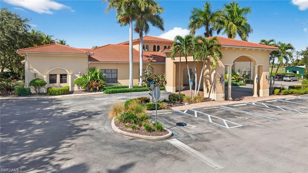 1966 Par Drive Naples, FL 34120 - Photo 24 of 32 View of building exterior with uncovered parking