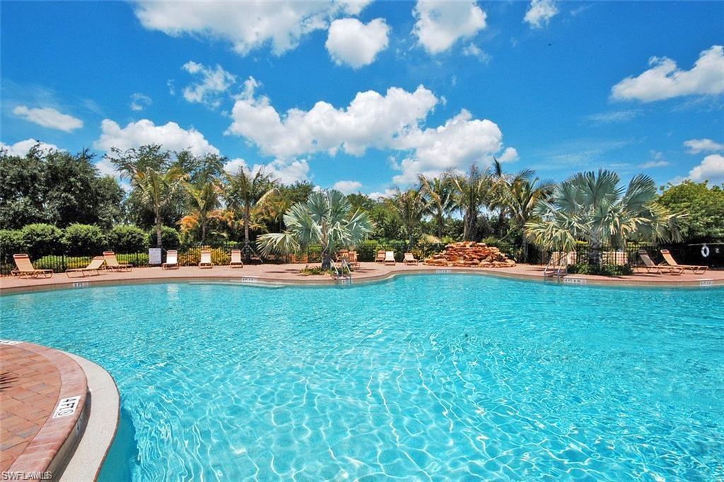 1966 Par Drive Naples, FL 34120 - Photo 26 of 32 Community pool with a patio area