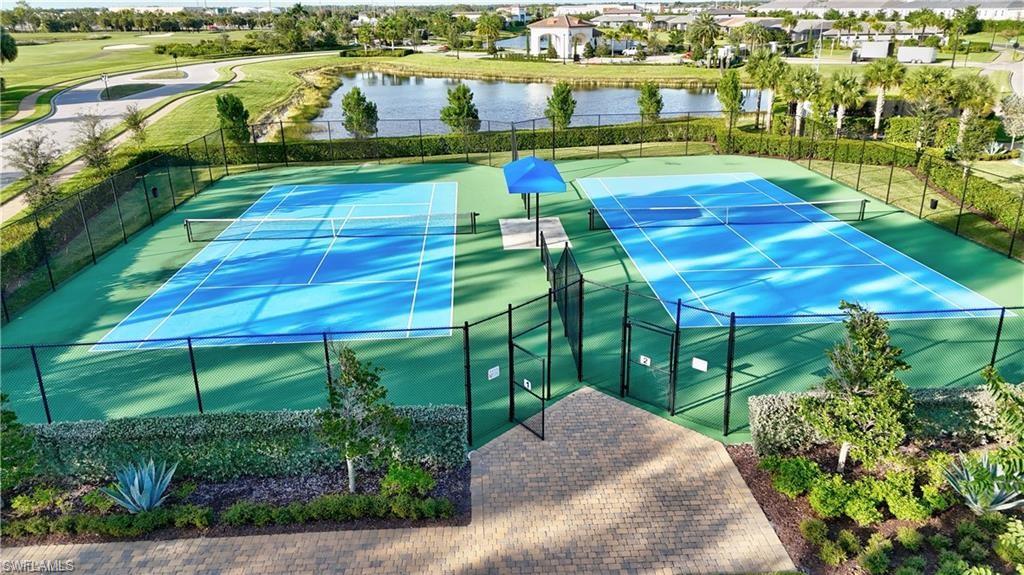 1966 Par Drive Naples, FL 34120 - Photo 27 of 32 View of tennis court with a water view