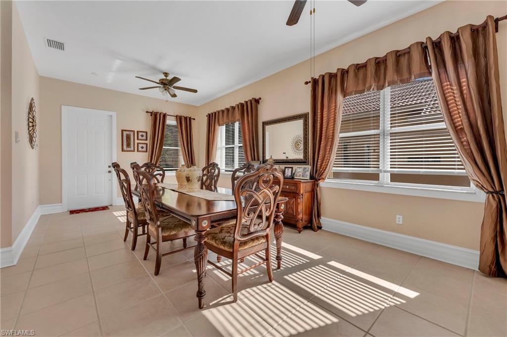 1966 Par Drive Naples, FL 34120 - Photo 7 of 32 Dining space featuring ceiling fan and light tile patterned floors