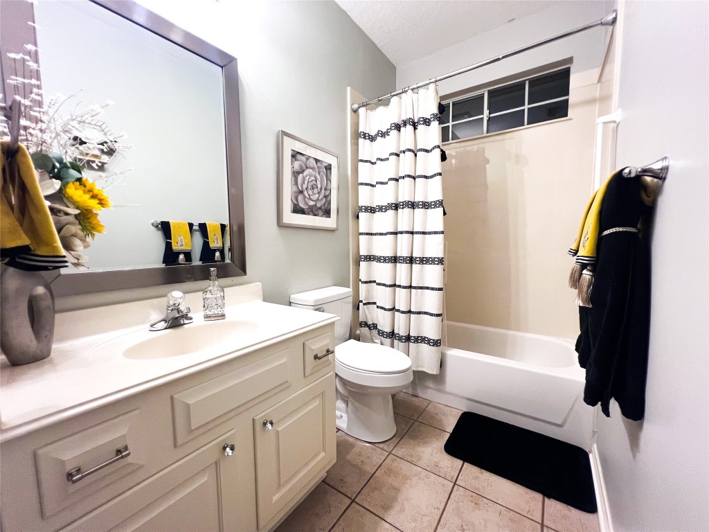 14420 Walters Road, Unit 24 Houston, TX 77014 - Photo 14 of 15 a bathroom with a sink a toilet and shower