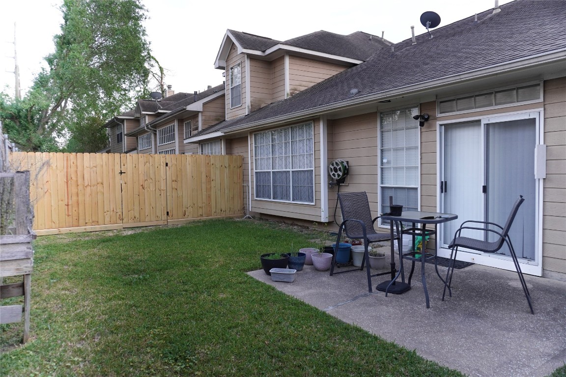 14420 Walters Road, Unit 24 Houston, TX 77014 - Photo 15 of 15 a view of a house with backyard and sitting area