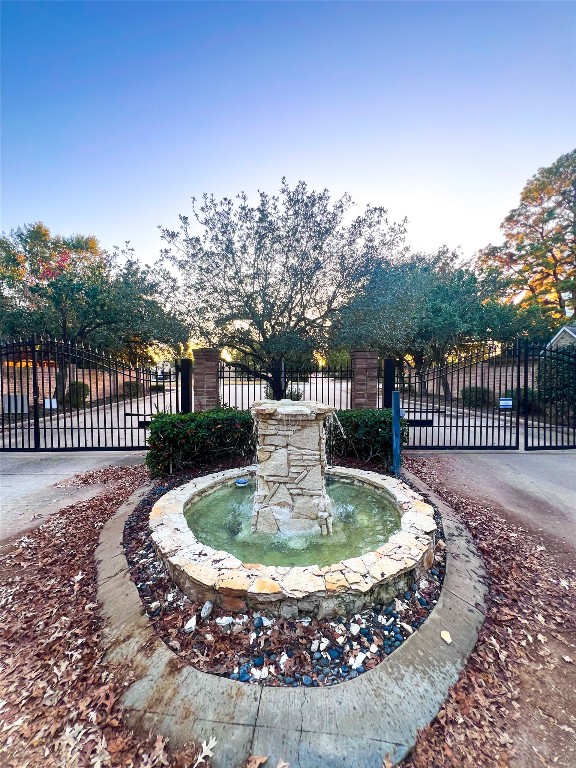14420 Walters Road, Unit 24 Houston, TX 77014 - Photo 5 of 15 a view of a fountain with a swimming pool in the backyard