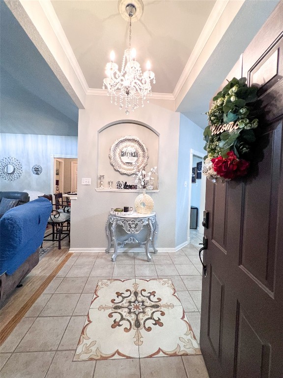 14420 Walters Road, Unit 24 Houston, TX 77014 - Photo 6 of 15 a bedroom with furniture and a chandelier