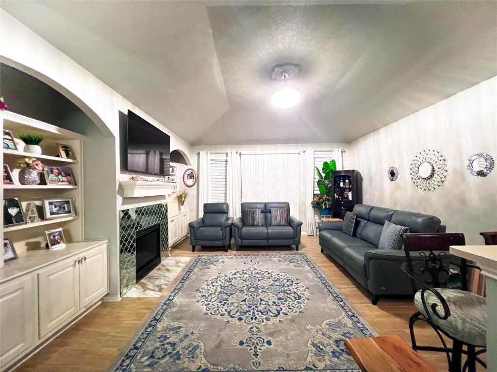 14420 Walters Road, Unit 24 Houston, TX 77014 - Photo 7 of 15 a living room with furniture fireplace and flat screen tv