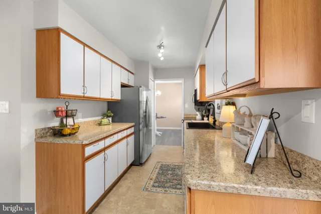 a view of a dining room with furniture wooden floor and chandelier
