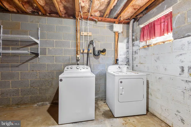 a view of a field with trees in the background