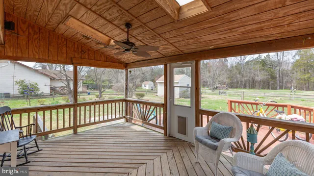 a view of a lake with boats and trees in the back