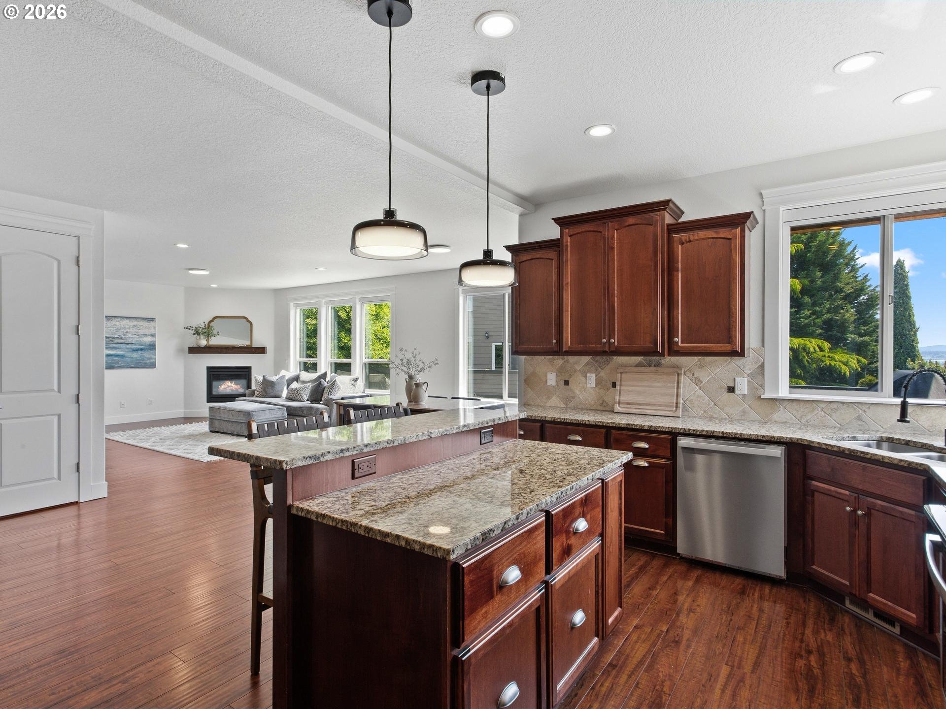 1012 Northwest Goodwin Street Camas, WA 98607 - Photo 10 of 44 a kitchen with a stove sink and cabinets