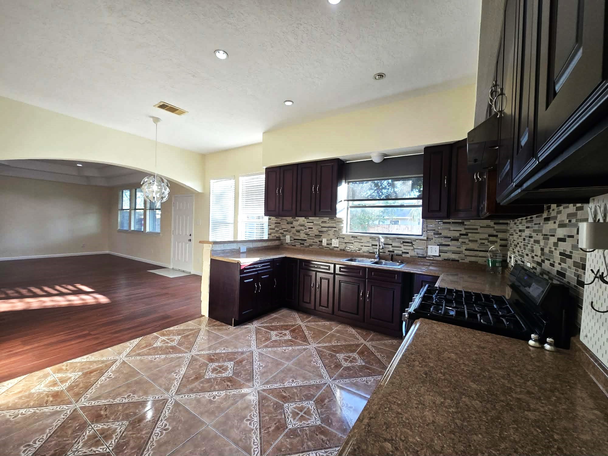 6641 Midfield Drive Houston, TX 77092 - Photo 7 of 21 a kitchen with a sink and cabinets