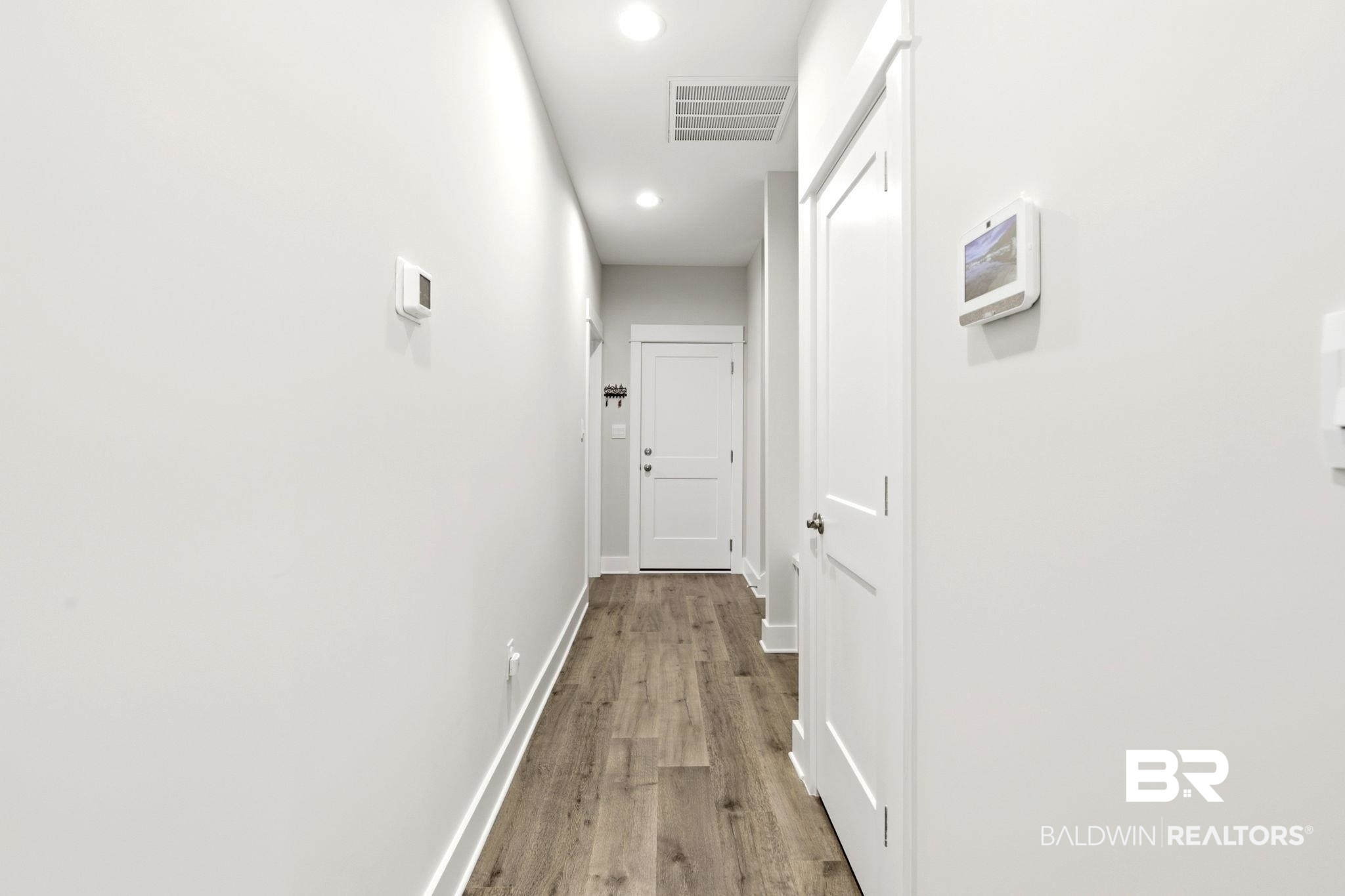 12132 Exbury Way Daphne, AL 36527 - Photo 24 of 47 Corridor with wood finished floors and recessed lighting