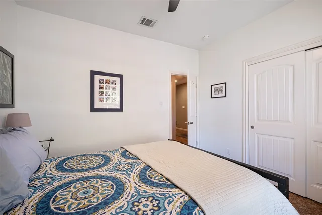 a bedroom with a bed and a couch