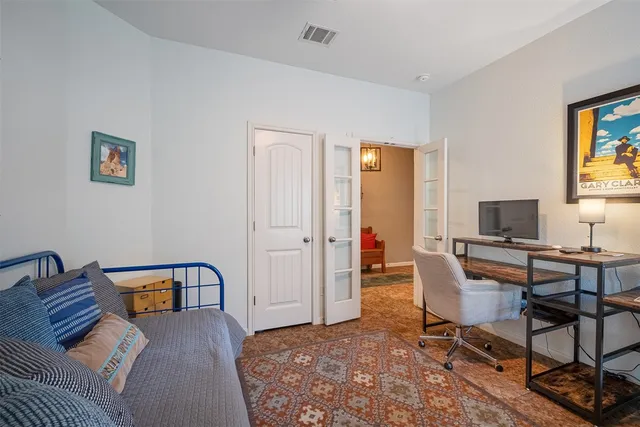 a view of a livingroom with lounge chair and a flat screen tv
