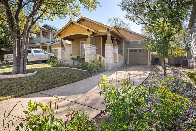 a front view of a house with a yard and porch