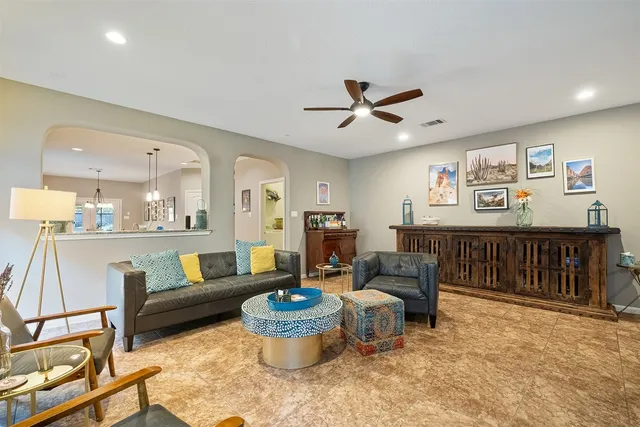 a living room with furniture and a large window