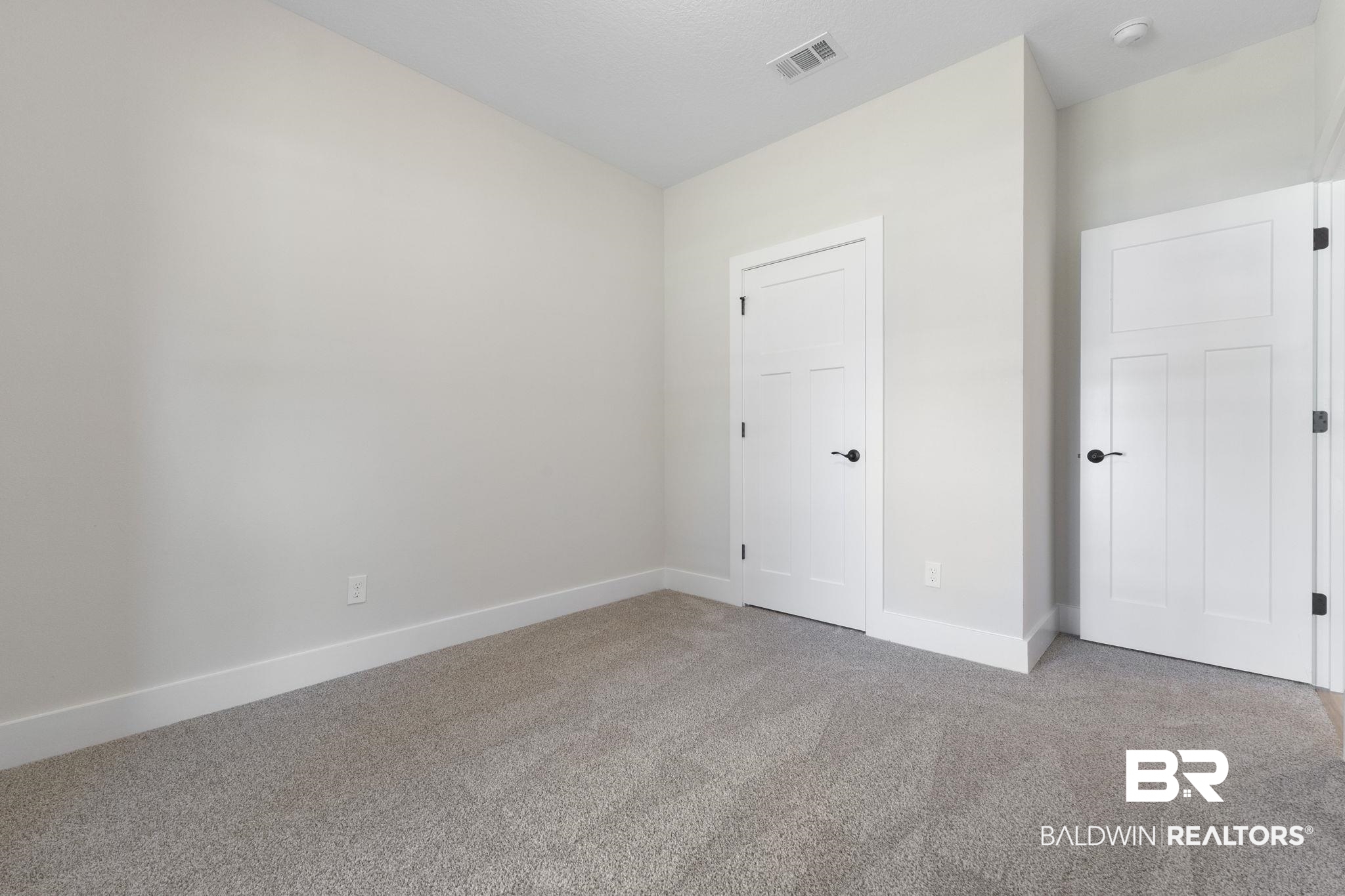 32563 Arbor Ridge Circle Lillian, AL 36549 - Photo 32 of 53 Unfurnished bedroom featuring carpet flooring and baseboards