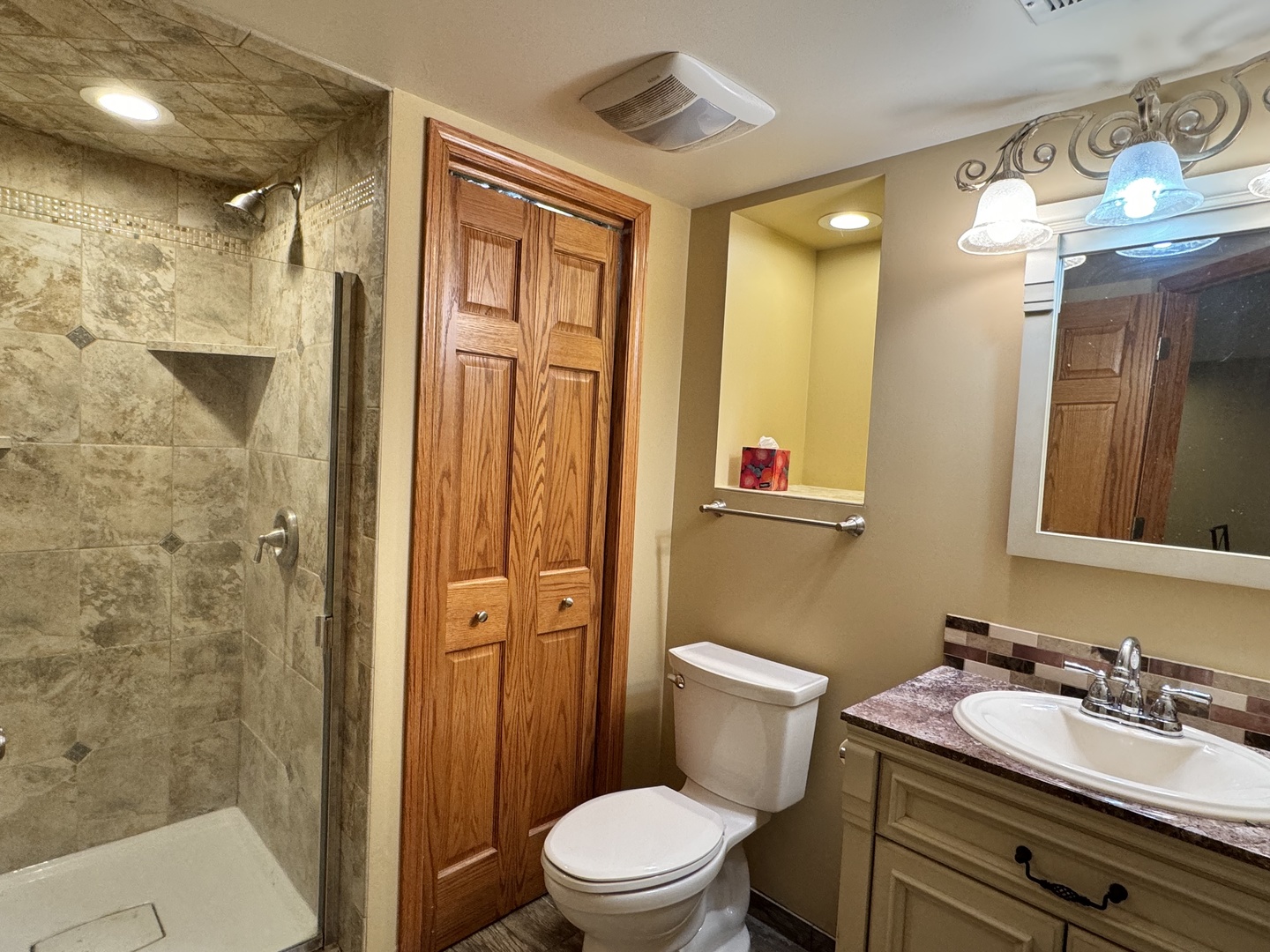 810 MacGregor Road Lockport, IL 60441 - Photo 12 of 25 a bathroom with a granite countertop sink toilet a mirror a vanity and shower