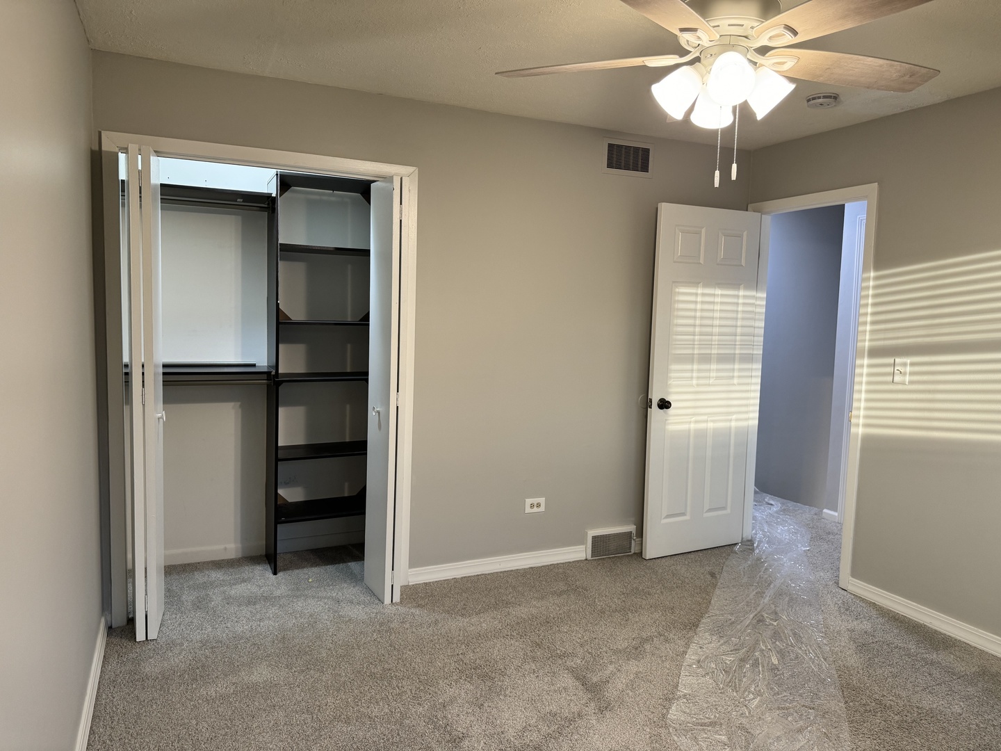810 MacGregor Road Lockport, IL 60441 - Photo 18 of 25 an empty room with closet and a ceiling fan