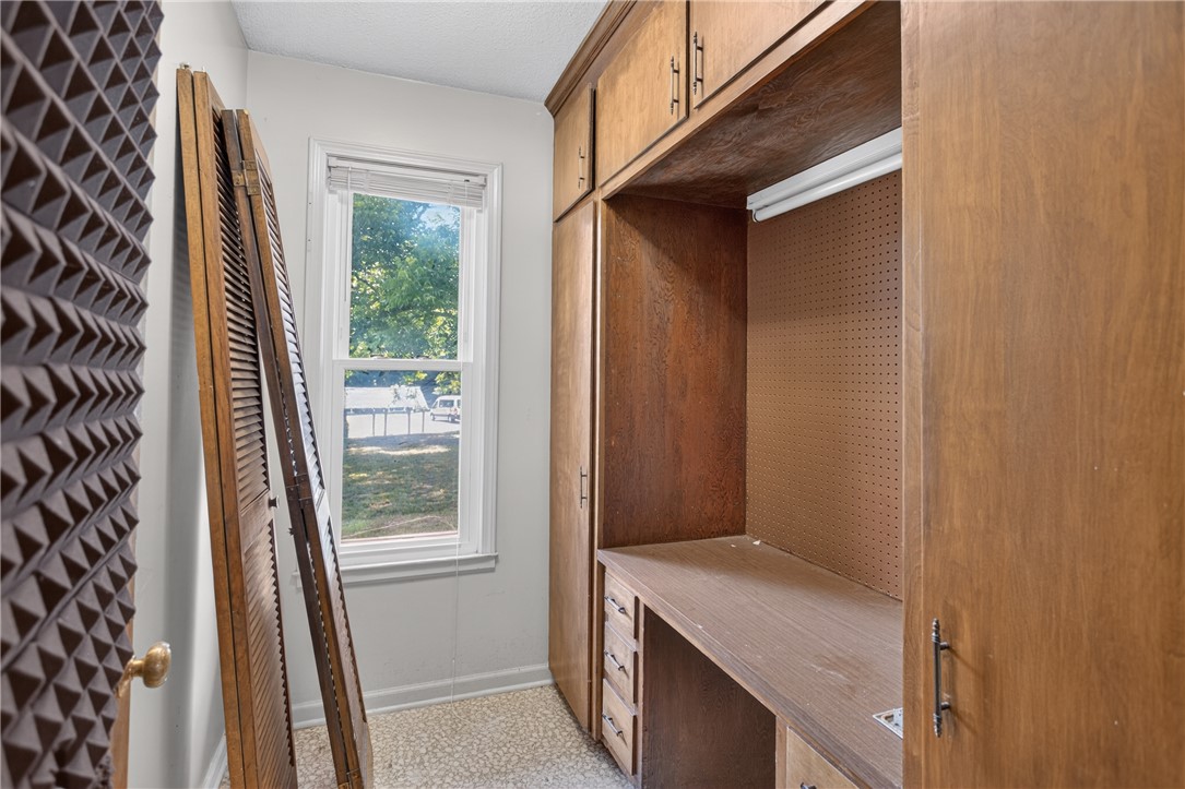 1412 Simpson Road Pendleton, SC 29670 - Photo 21 of 48 Functional workspace with built-in cabinetry and a sun-filled window overlooking the green outdoors.