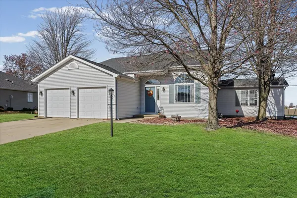 a house that has a tree in front of it