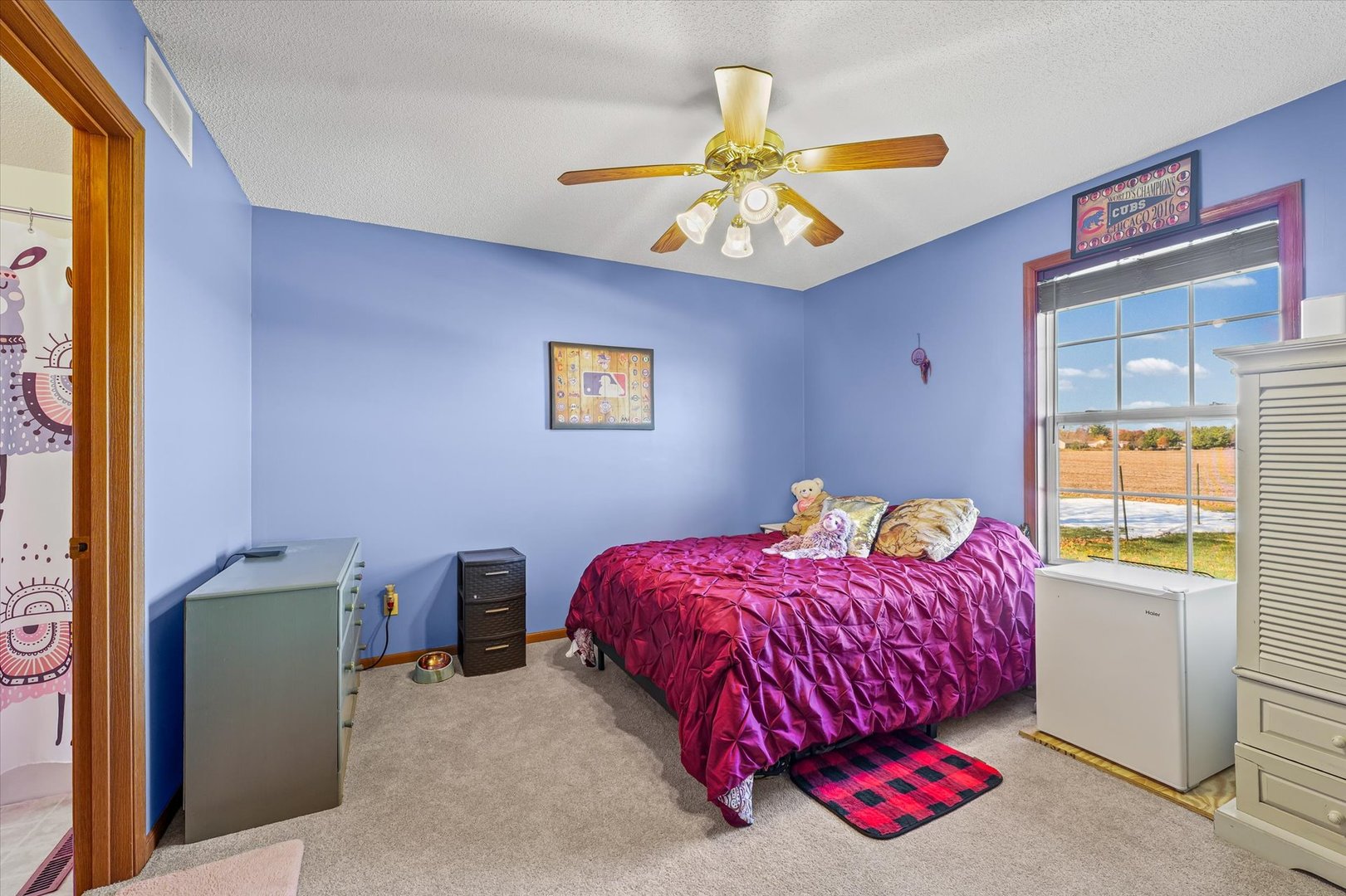 707 Country View Drive Philo, IL 61864 - Photo 13 of 28 a bedroom with a bed and a chandelier