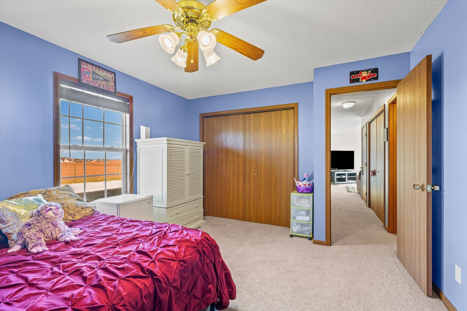 707 Country View Drive Philo, IL 61864 - Photo 14 of 28 a bedroom with a bed and a chandelier