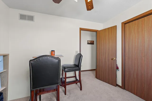 a bathroom with a double vanity sink toilet mirror and shower