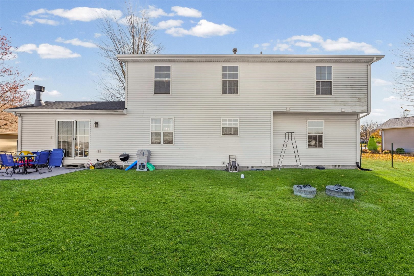 707 Country View Drive Philo, IL 61864 - Photo 26 of 28 a backyard of a house with table and chairs