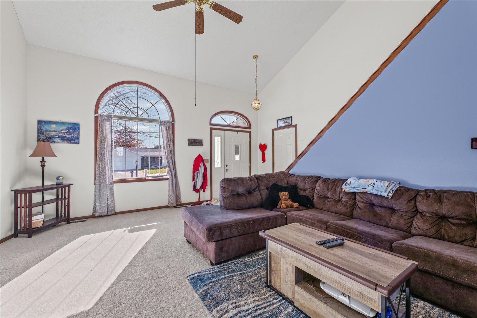 707 Country View Drive Philo, IL 61864 - Photo 5 of 28 a living room with furniture a rug and a clock